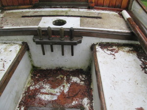 Bridge deck at forward end of cockpit has the hole for the mainmast and a nice rack of belaying pins.